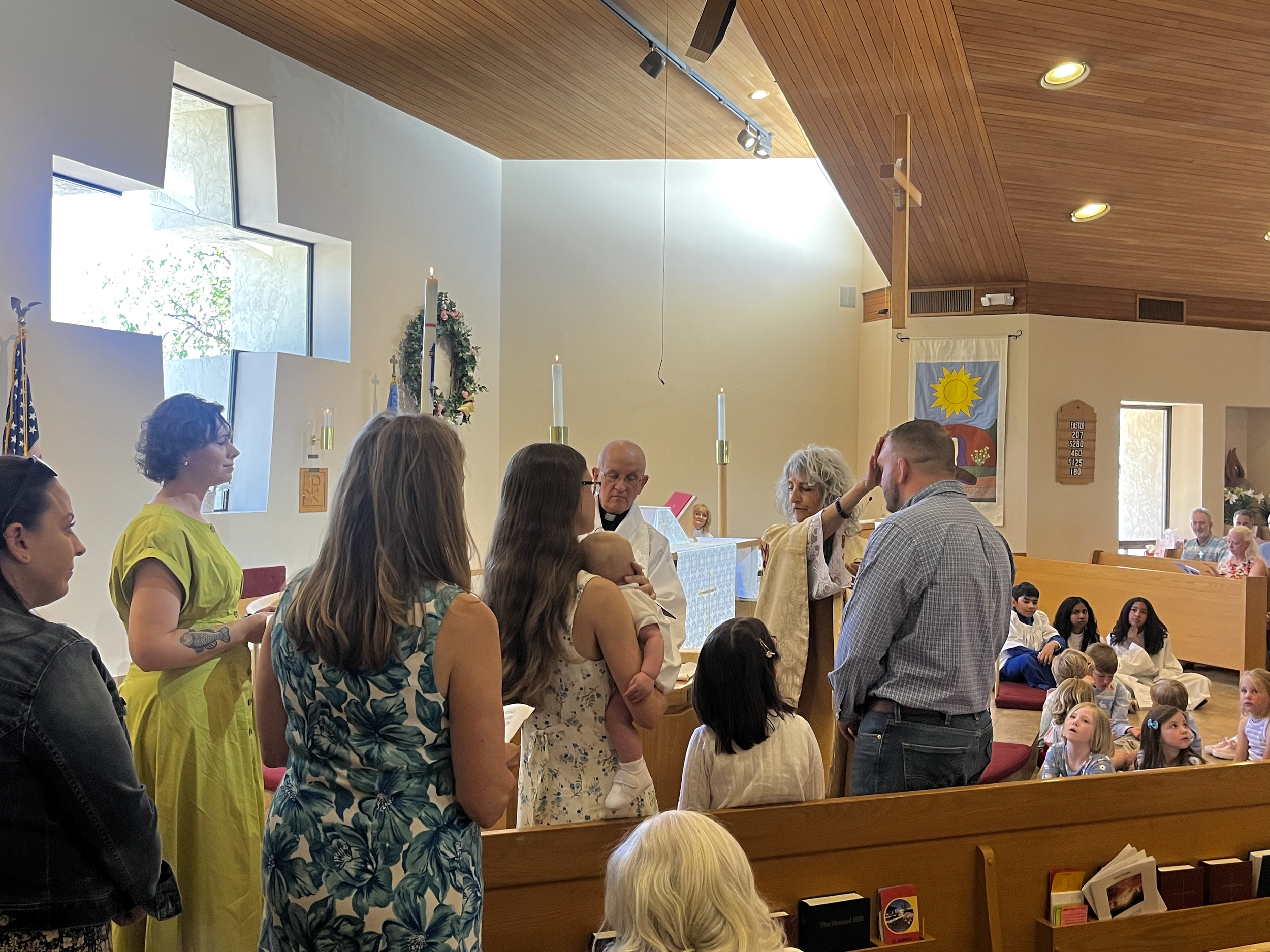 People gathered with clergy in St. Alban’s sanctuary.